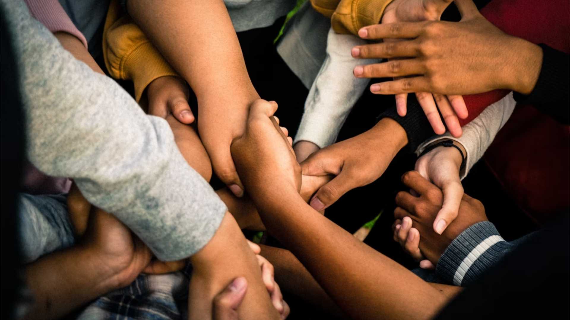 Interlocking Hands Symbolizing Working Together